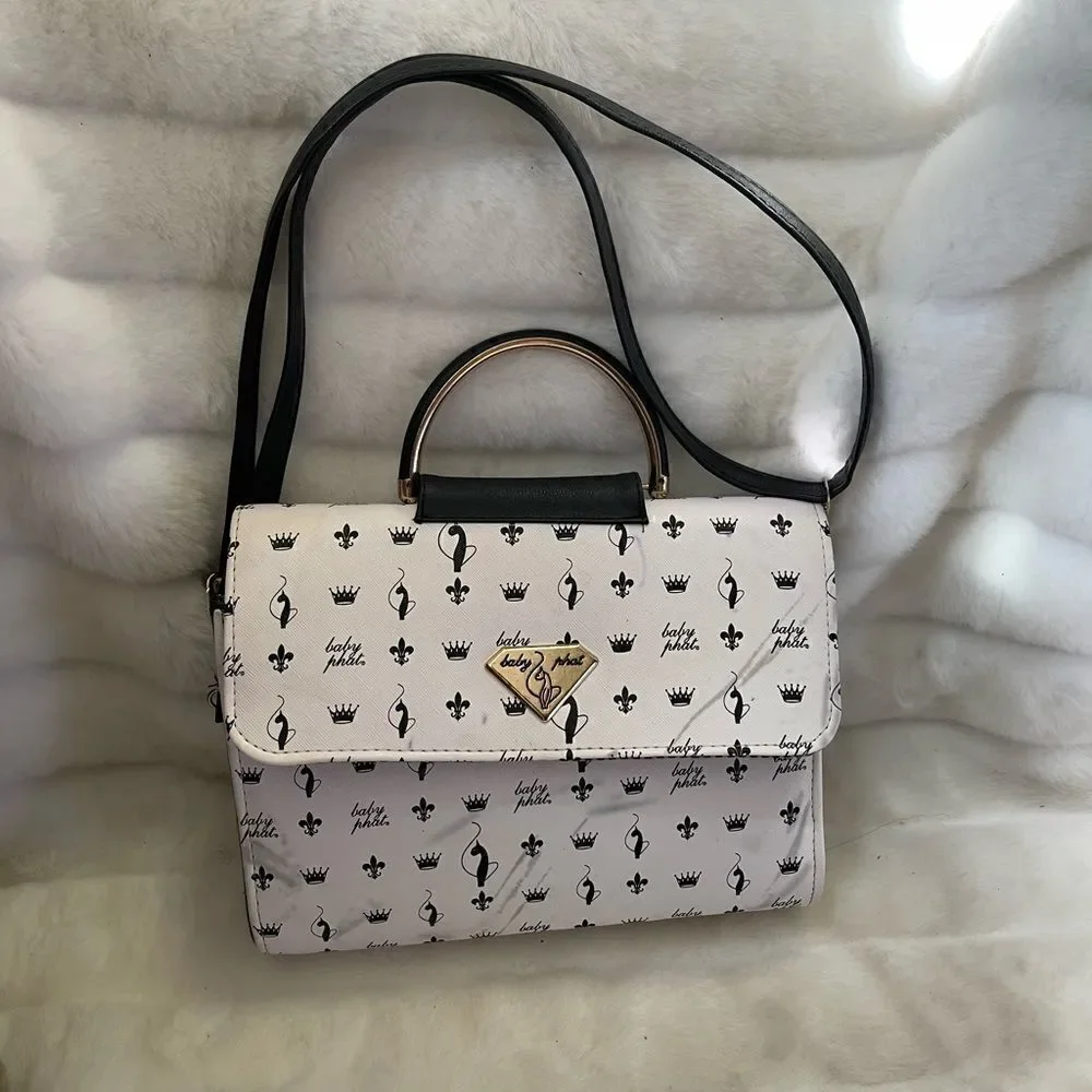 Baby Phat black and white logo satchel/shoulder bag with gold tone accent.